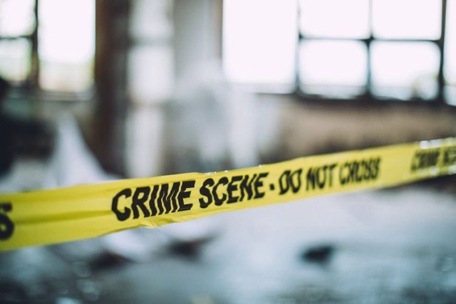 Crime scene police tape at location of workplace violence.
