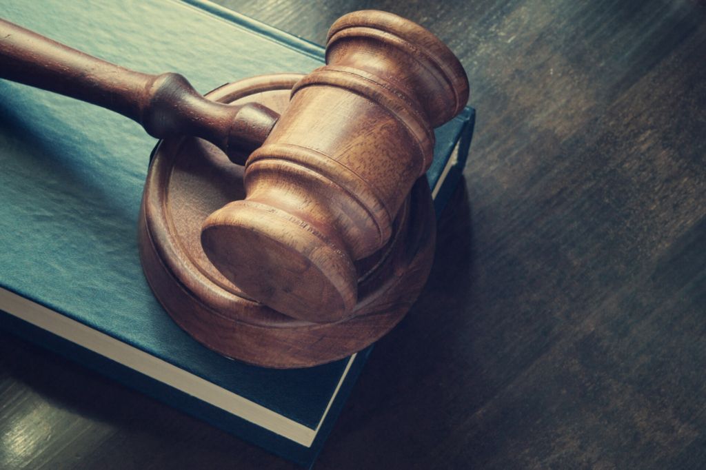 Image of a wooden gavel on top of a book