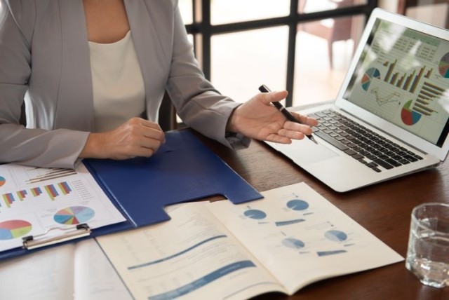 Woman working on data charts