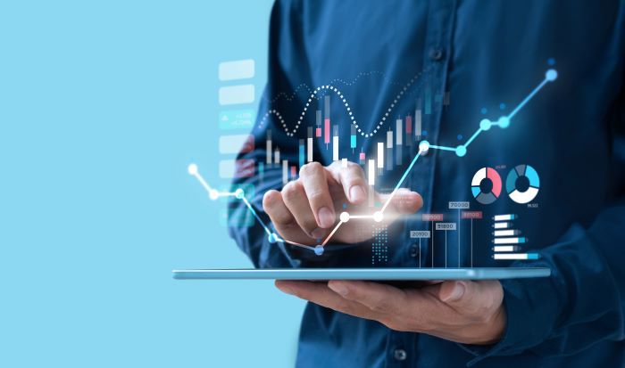 Man looking at data on tablet