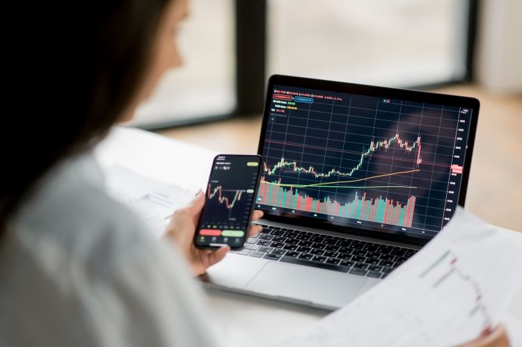 Crypto trader using laptop