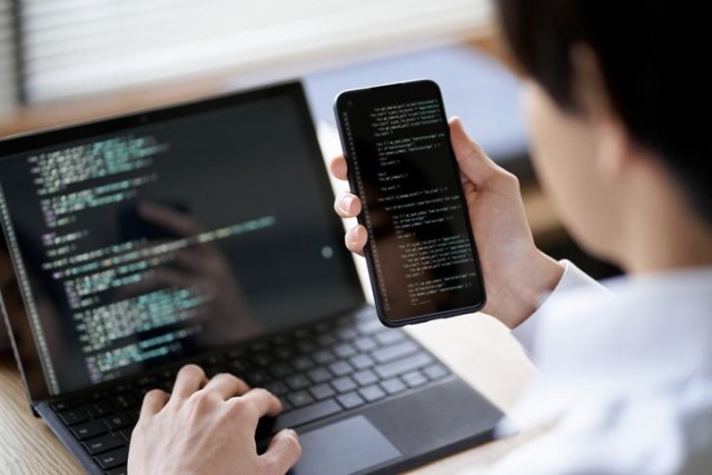 programmer checking the operation of the code