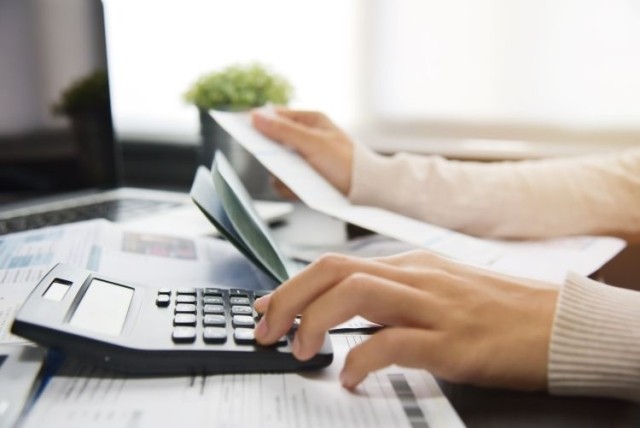 Woman calculating costs