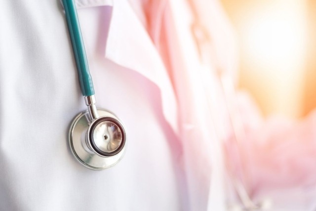 Doctor wearing lab coat and stethoscope