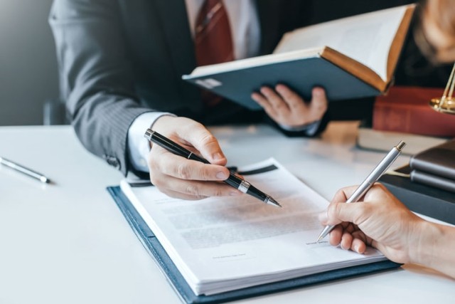 lawyer client signing document