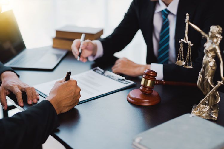 lawyer client signing contract paperwork bankruptcy