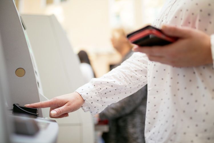 person using fingerprint scanner