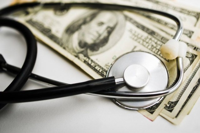 Stethoscope on money